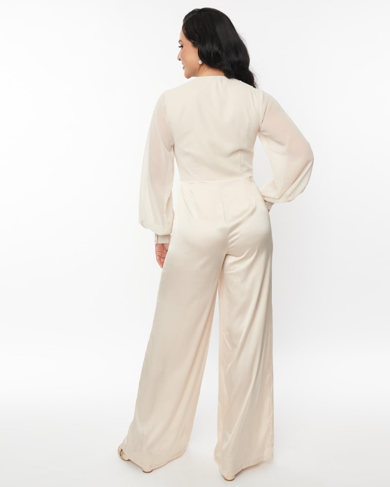 White jumpsuit with skirt deals overlay